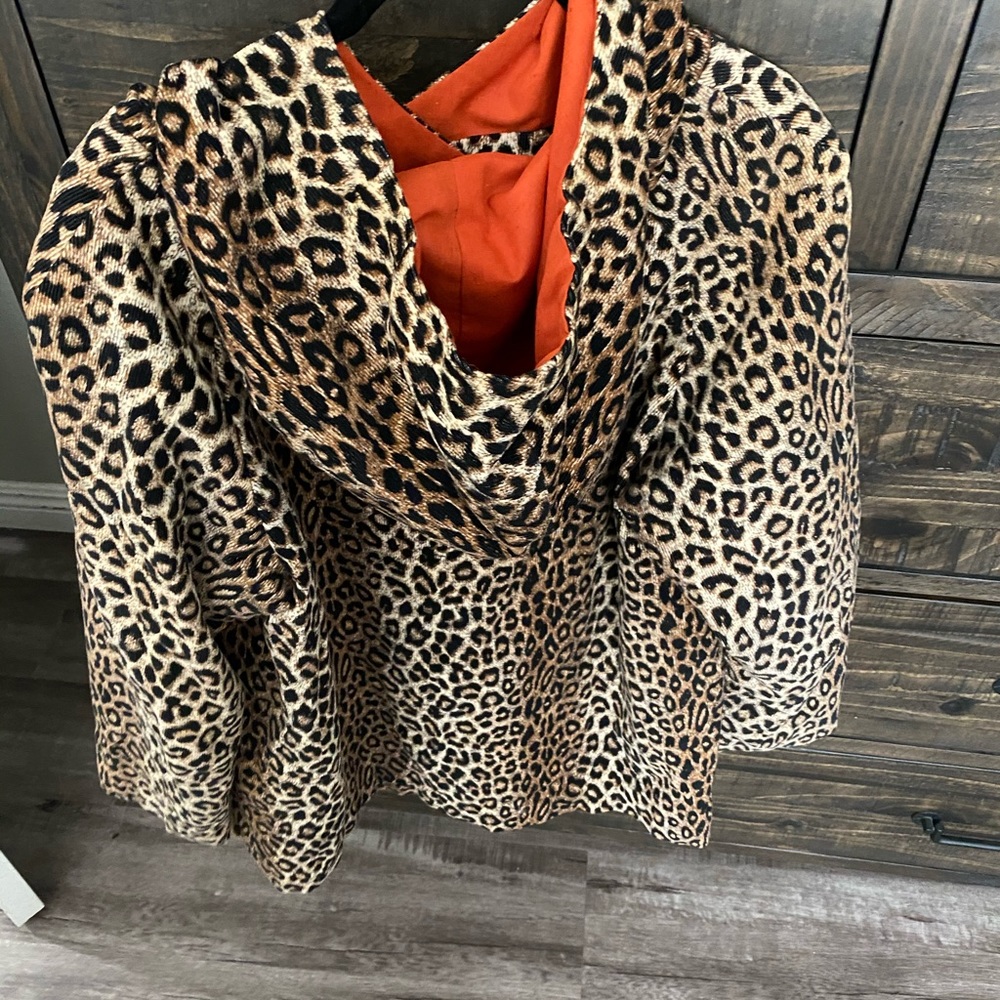 Vintage leopard coat with orange lining.